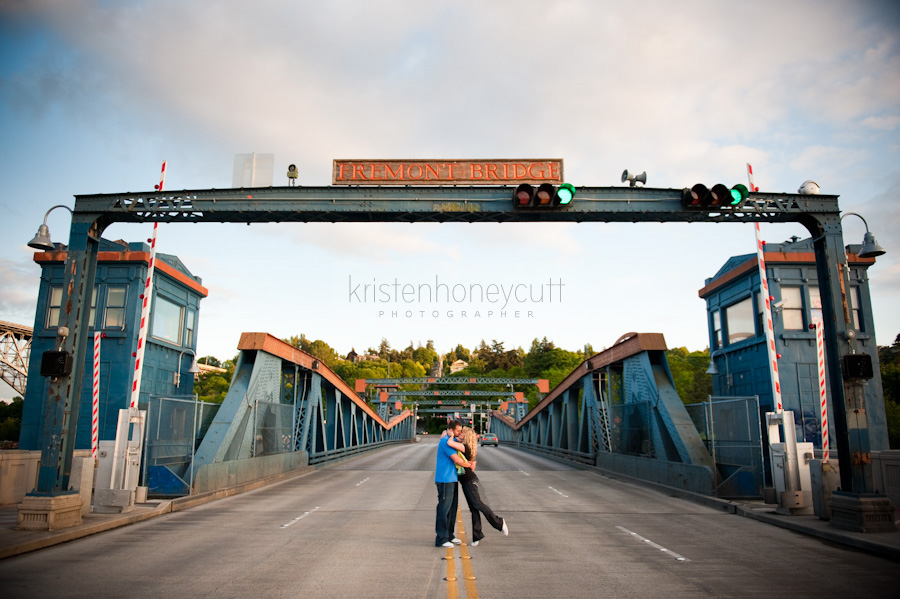 Seattle couple share a kiss on the Fremont Bridge in Seattle.