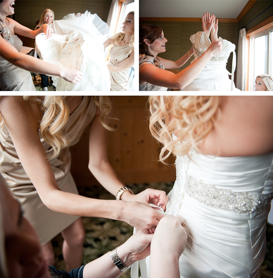 Bridesmaids assist as the bride puts on her gown for her wedding