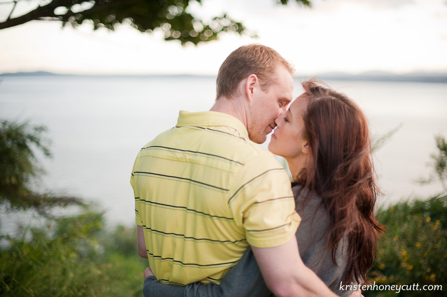 a romantic kiss at Discovery Park for this engagement portrait
