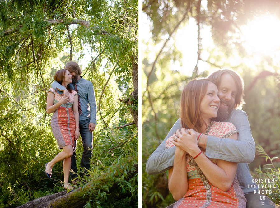 engaged couple cuddle for portraits in seattle's sunny arboretum