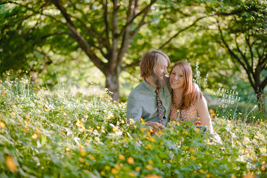 natural pretty engagement portrait in yellow buttercup flowers in seattle's arboretum