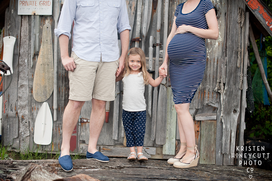 family maternity session at beach cabin