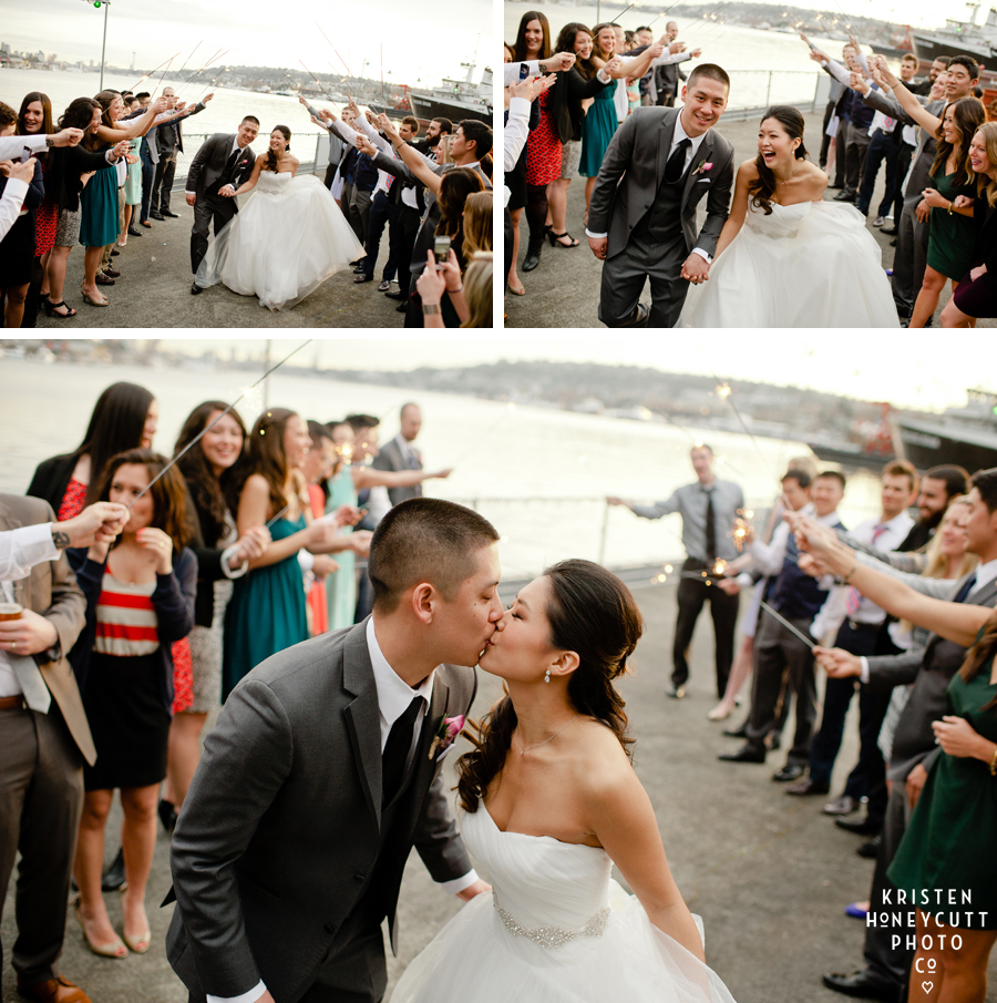 Bride and Groom exit through row of sparklers at Seattle's Ivar's Salmon House on Lake Union.