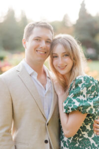 couple smiles for sunny portrait outside